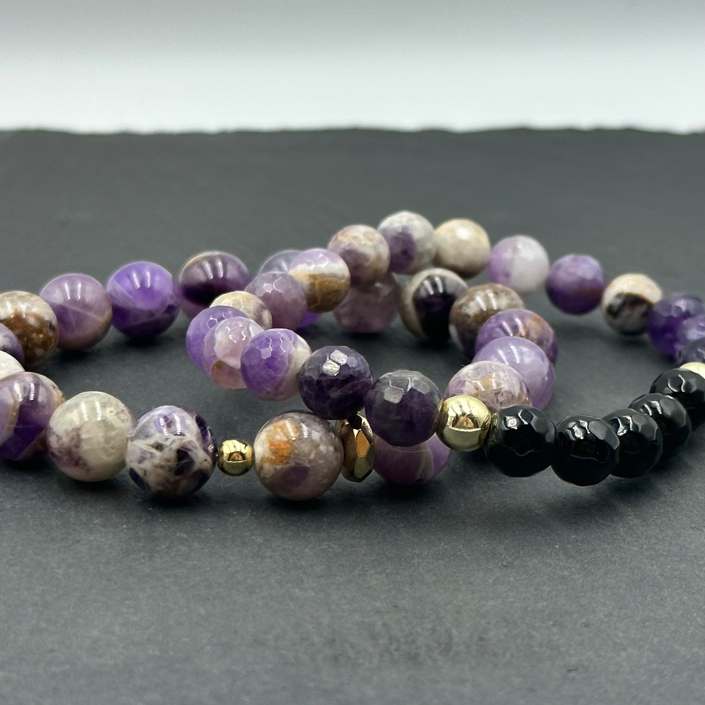 Aproce no dabīgiem Drūzu Ametista (Amethyst) akmeņiem